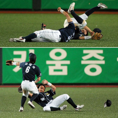  2일 광주 무등경기장에서 벌어진 '2009 프로야구' KIA 타이거즈와 두산 베어스의 경기에서 8회말 무사 KIA 2번타자 김종국의 외야 플라이를 두산 외야수 김재호와 이종욱이 잡으려다 넘어지고 있다. 이종욱은 이날 오른쪽 턱에 깊은 상처를 입고 병원으로 후송됐다. 